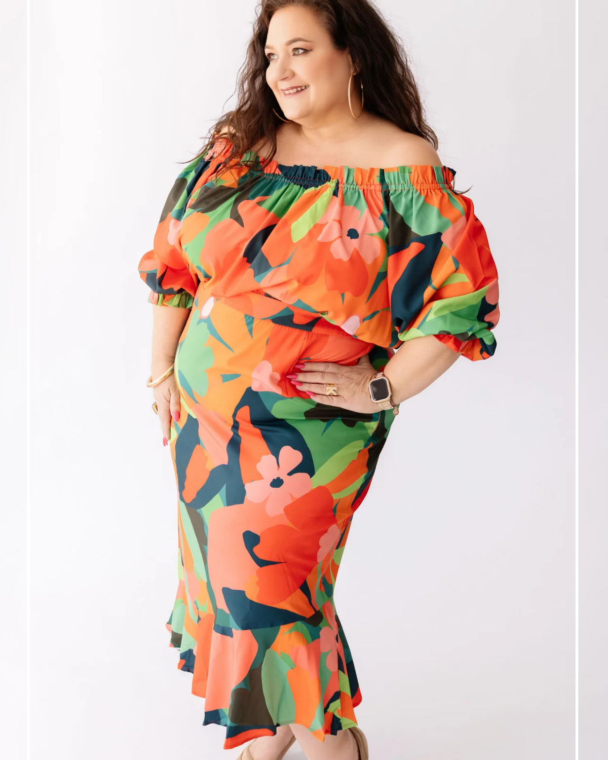 Woman wearing a colorful floral dress on a white background | Model Photo - Kelly | Harlow + James Boutique | West Des Moines, IA