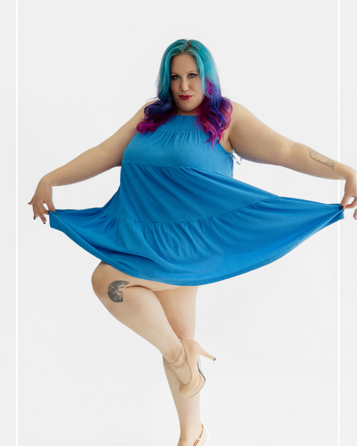 Woman wearing a blue dress with colorful hair on a white background | Model Photo - Morgana | Harlow + James Boutique | West Des Moines, IA