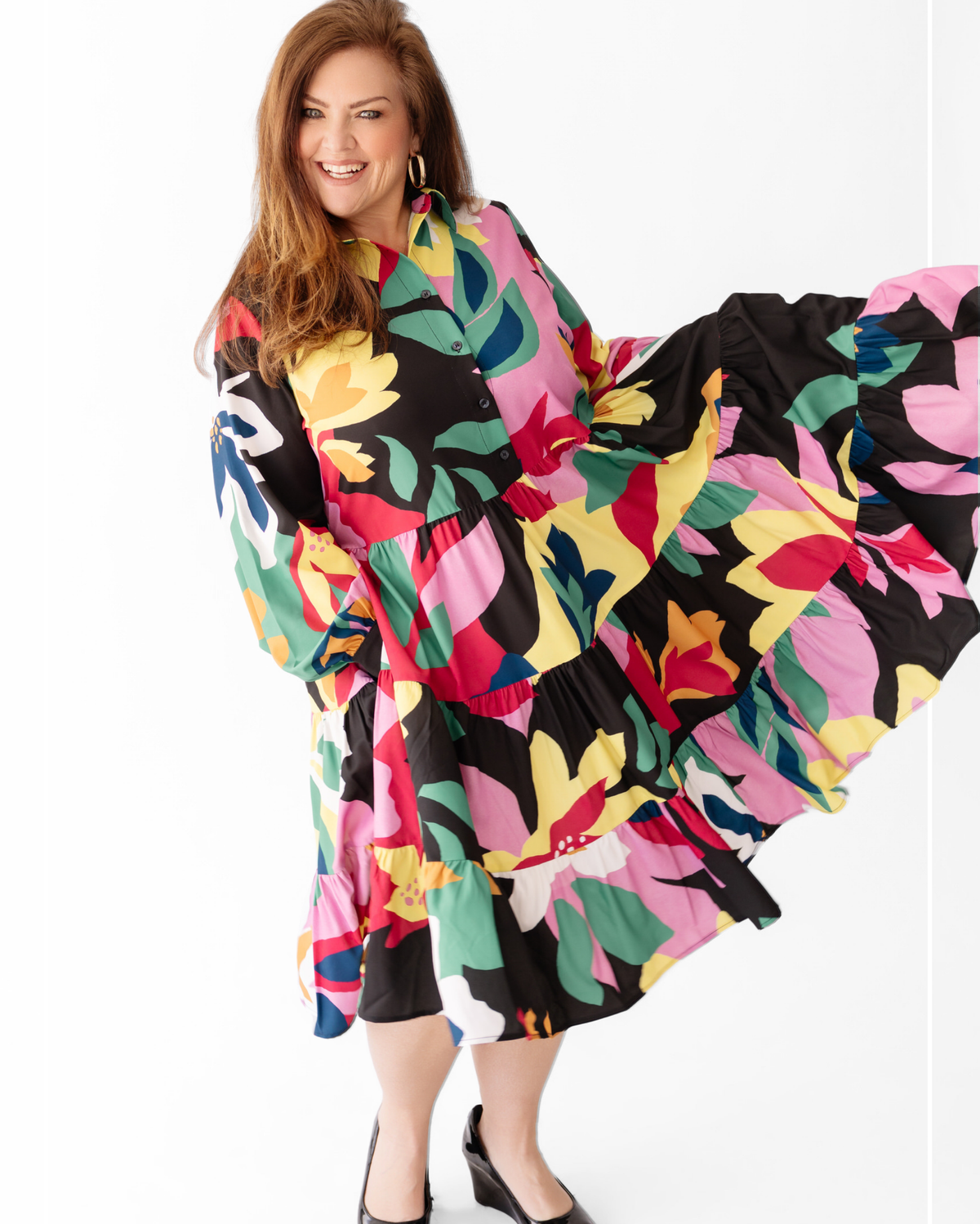 Woman wearing a colorful floral dress on a white background | Model Photo - Brenda | Harlow + James Boutique | West Des Moines, IA