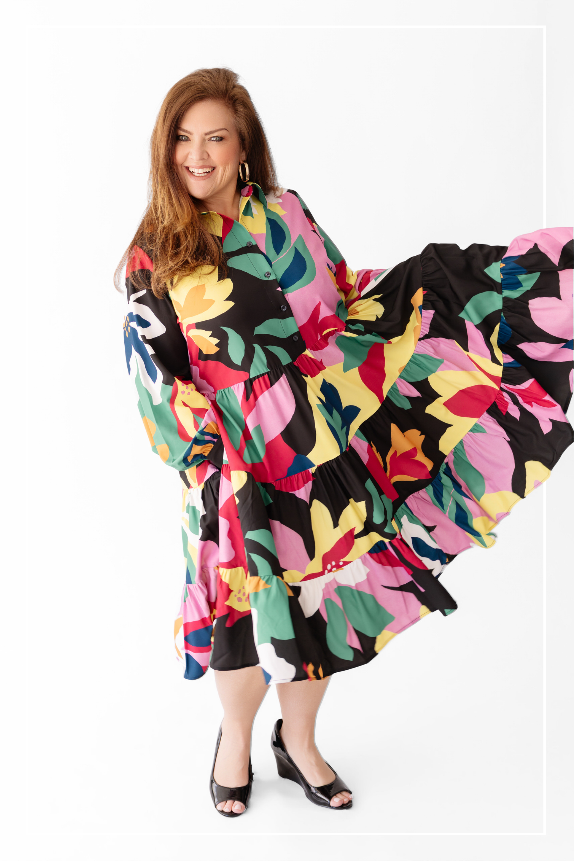 Woman wearing a colorful floral dress on a white background | Model Photo - Brenda | Harlow + James Boutique | West Des Moines, IA