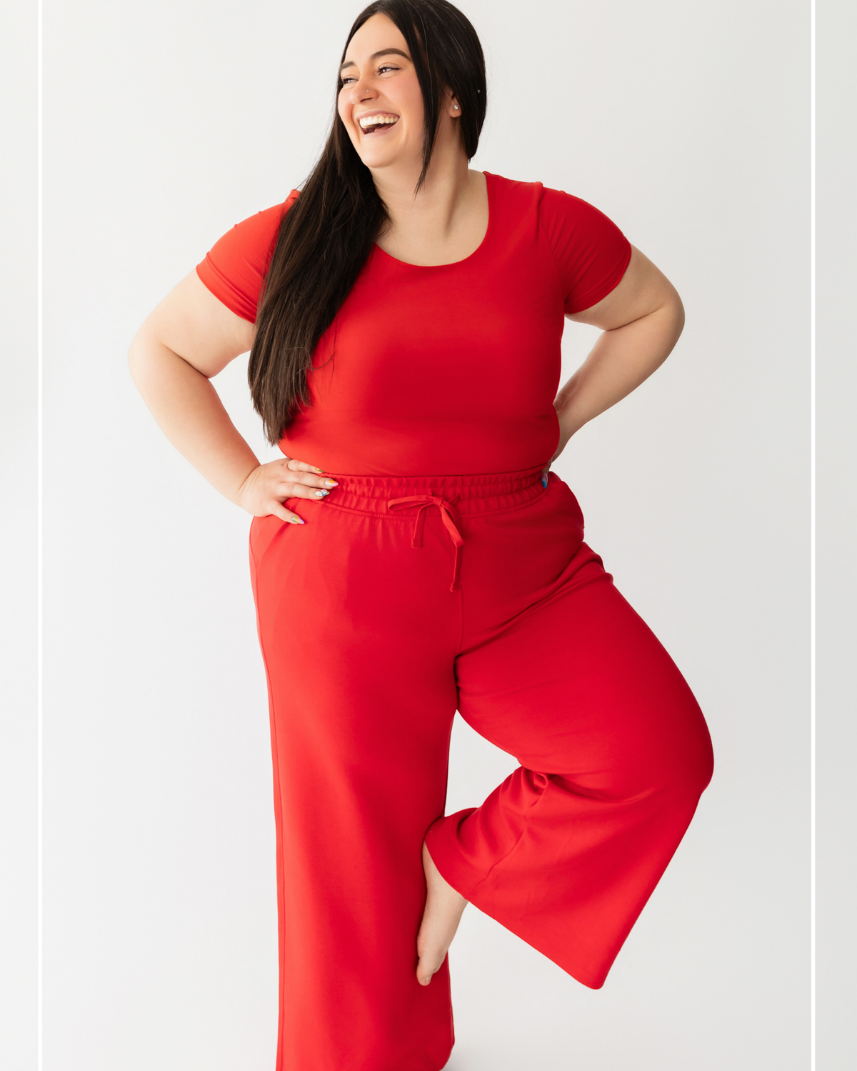 Woman wearing a red outfit on a light gray background | Model Photo - Jenny | Harlow + James Boutique | West Des Moines, IA