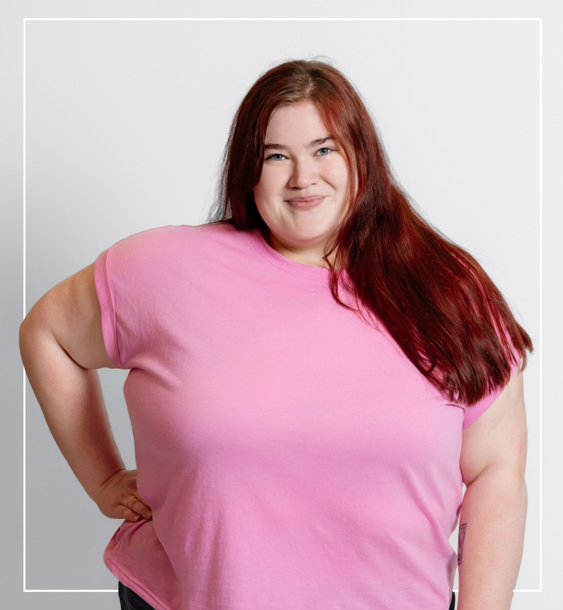 Woman wearing a pink shirt against a plain background | Staff - Cora Jane | Harlow + James Boutique | West Des Moines, IA