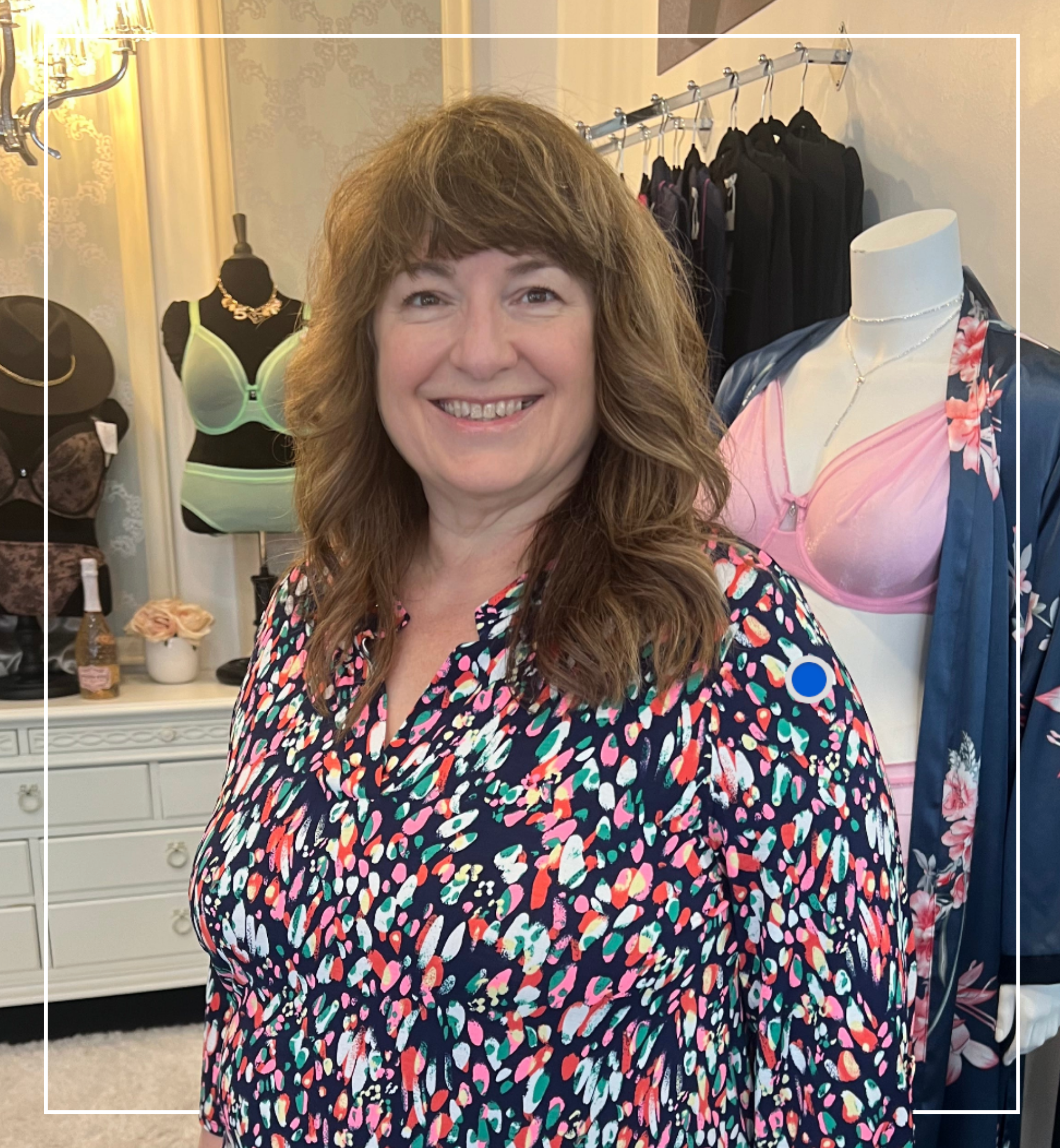 Woman standing in a store with mannequins and clothing in the background | Staff - Jackie | Harlow + James Boutique | West Des Moines, IA
