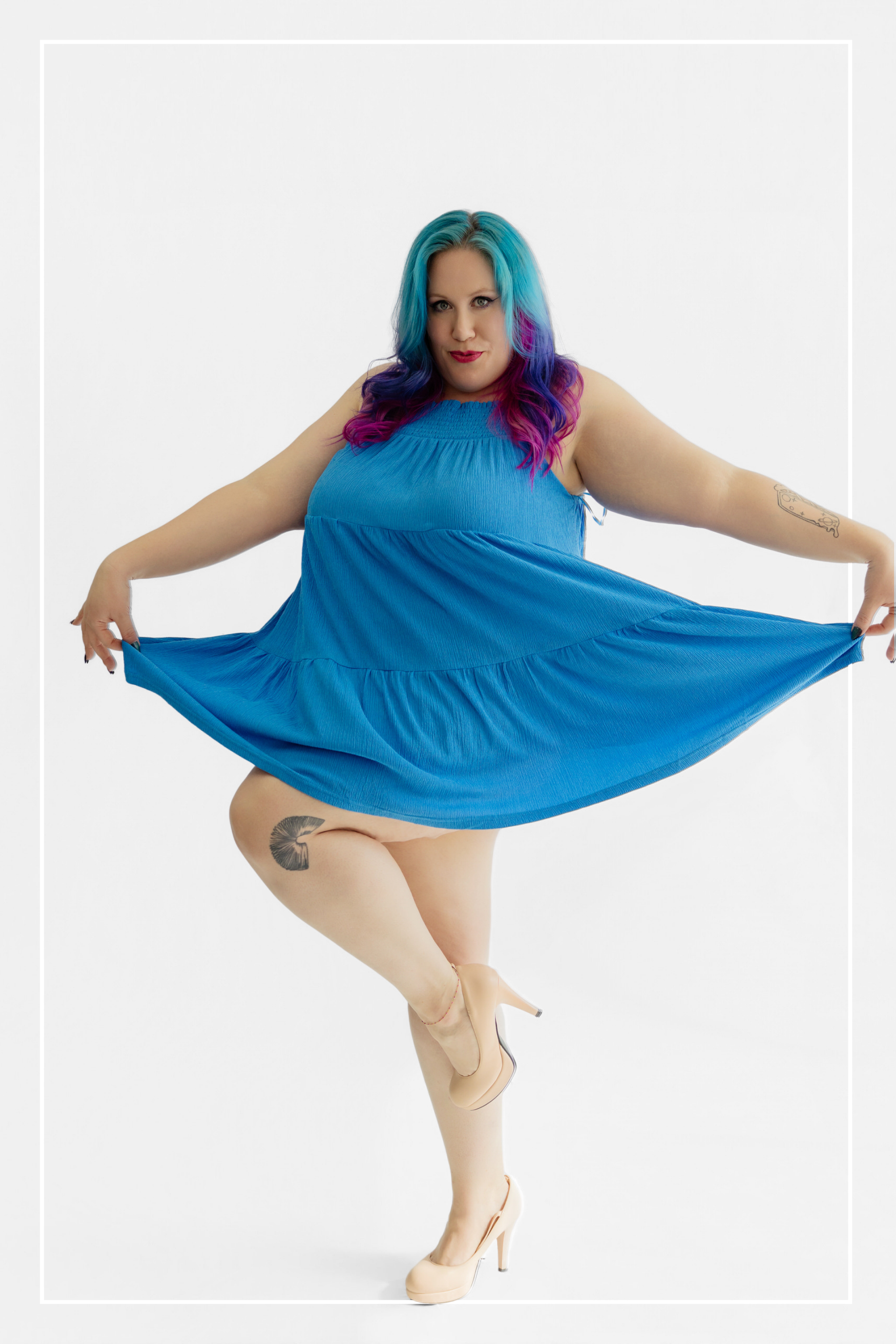 Woman wearing a blue dress with colorful hair on a white background | Model Photo - Morgana | Harlow + James Boutique | West Des Moines, IA